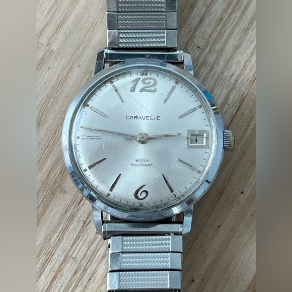 Vintage Caravelle by Bulova N7 1977 Ladies Gold Tone  Caravelle Vintage Mechanical Watch Stainless Dial Case Stretch Bracelet Date